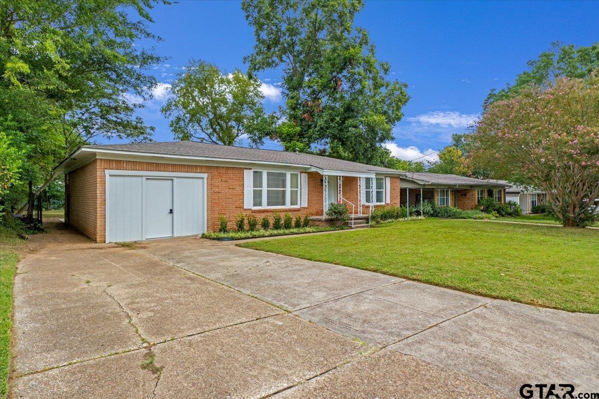 2308 Lingner Drive Tyler, TX 75701 - Photo 26 of 27 a front view of house with yard and green space