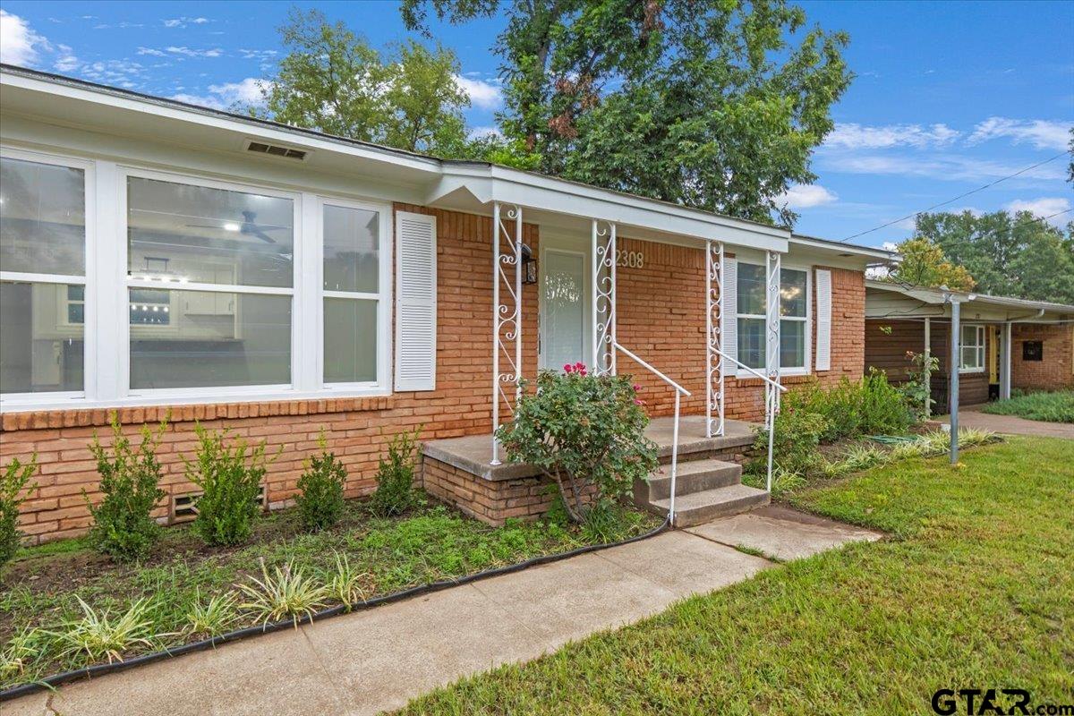 2308 Lingner Drive Tyler, TX 75701 - Photo 3 of 27 front view of a house with a yard