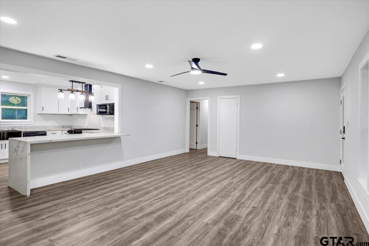 2308 Lingner Drive Tyler, TX 75701 - Photo 7 of 27 a view of kitchen with wooden floor and electronic appliances