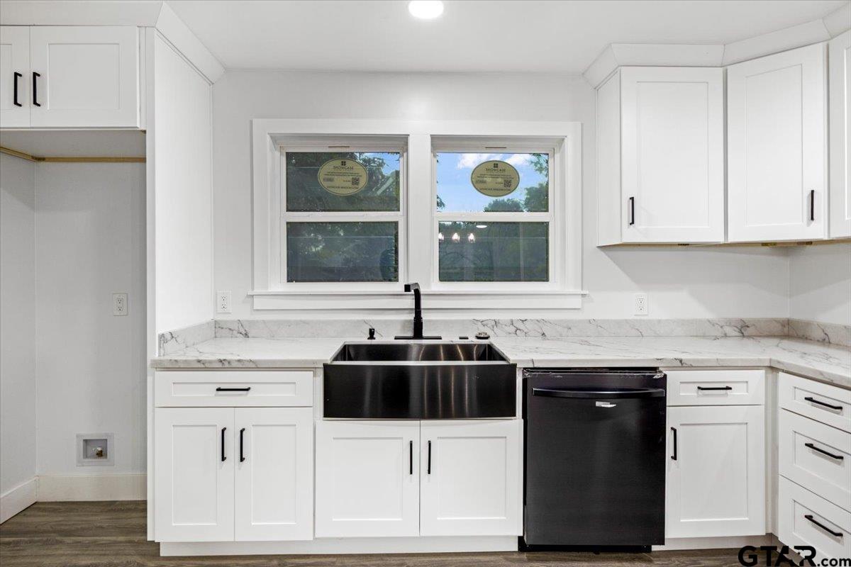 2308 Lingner Drive Tyler, TX 75701 - Photo 9 of 27 a kitchen with granite countertop a sink and cabinets