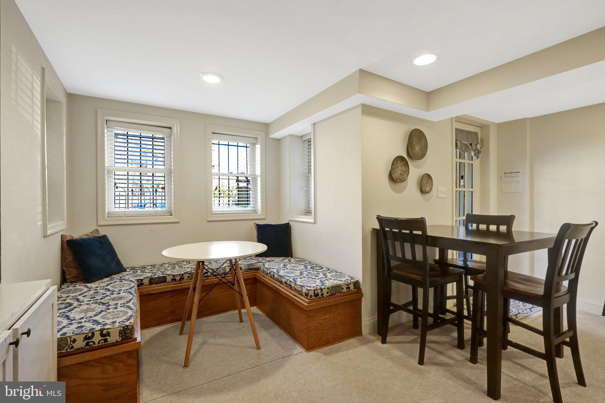 11 6th Street Southeast Washington, DC 20003 - Photo 35 of 48 a dining room with a wooden table and chairs