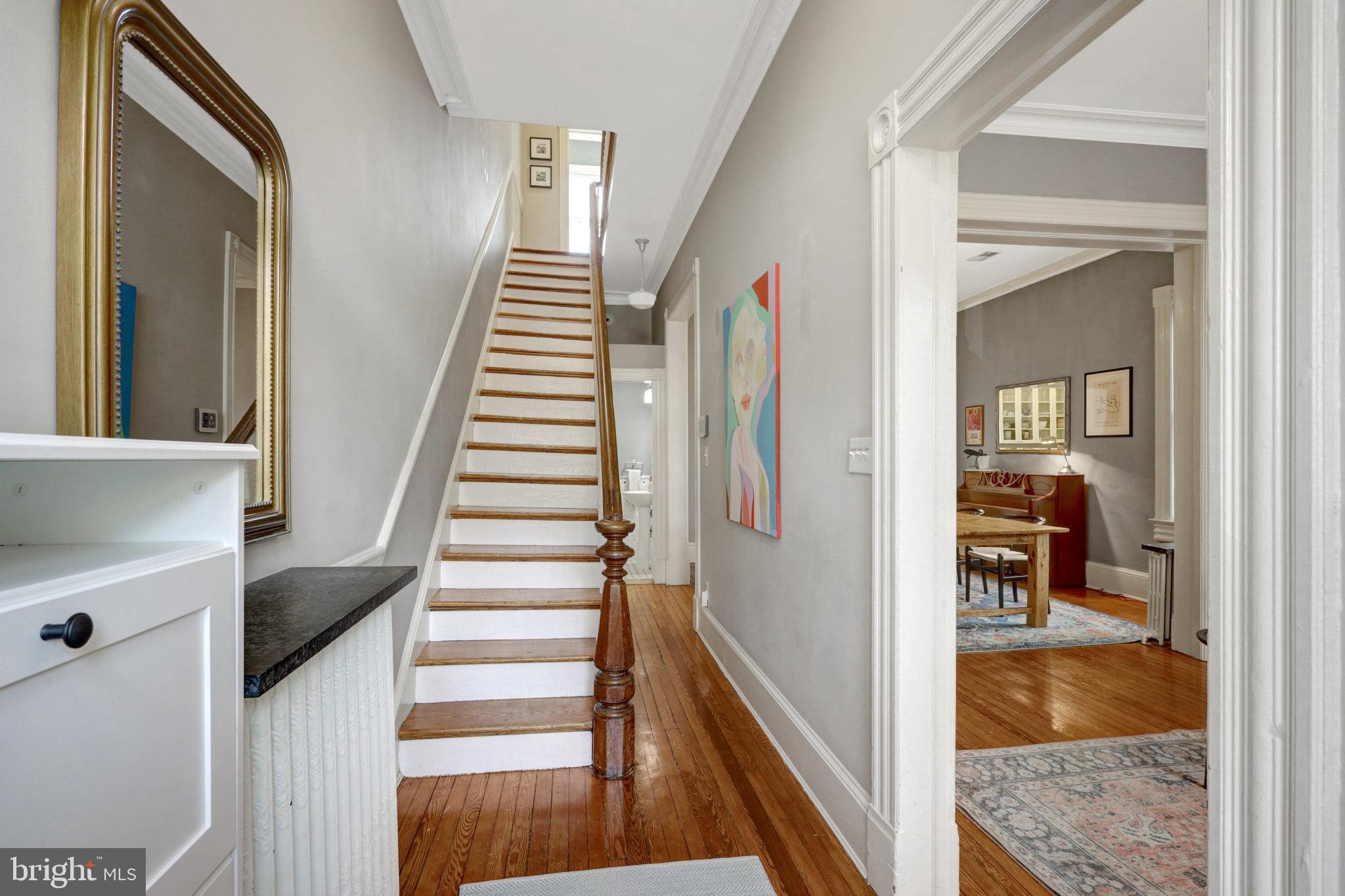 11 6th Street Southeast Washington, DC 20003 - Photo 4 of 48 a view of a hallway with wooden floor and entryway