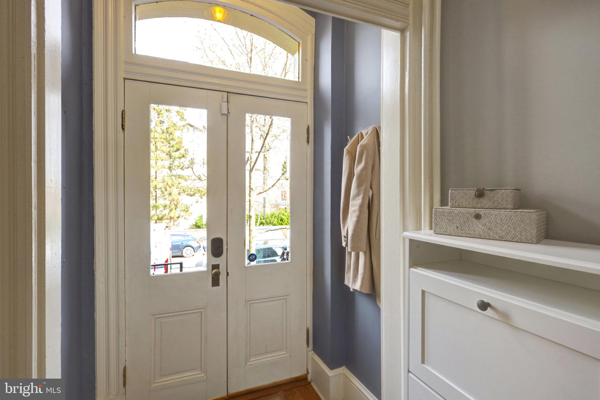 11 6th Street Southeast Washington, DC 20003 - Photo 5 of 48 a bathroom with a sink a mirror and window