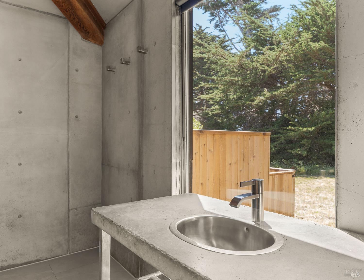 39412 Pacific Reach The Sea Ranch, CA 95497 - Photo 17 of 31 a bathroom with a sink and a large mirror