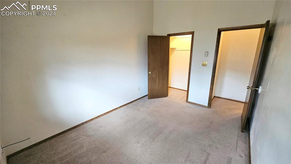 401 Forest Edge Road, Unit B8 Woodland Park, CO 80863 - Photo 15 of 19 an empty room with windows