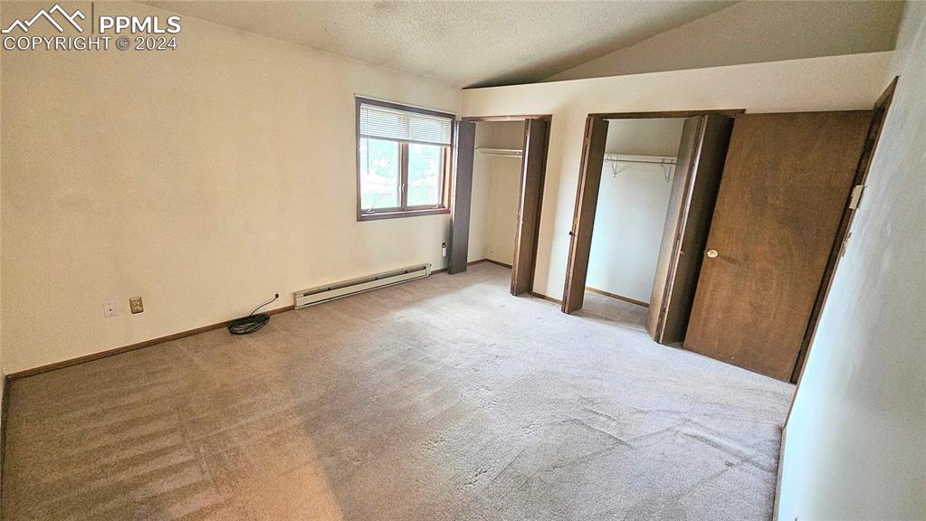 401 Forest Edge Road, Unit B8 Woodland Park, CO 80863 - Photo 17 of 19 an empty room with windows