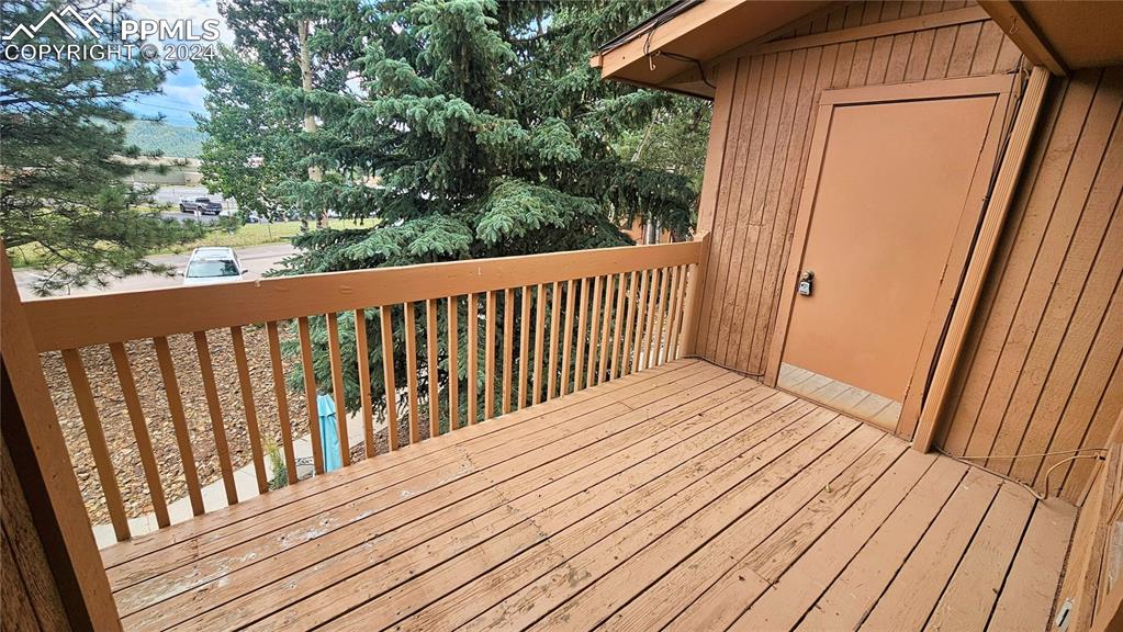 401 Forest Edge Road, Unit B8 Woodland Park, CO 80863 - Photo 3 of 19 a balcony with wooden floor