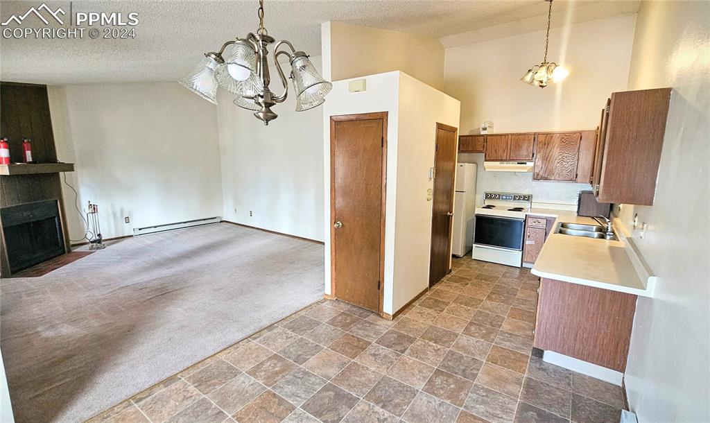 401 Forest Edge Road, Unit B8 Woodland Park, CO 80863 - Photo 8 of 19 a view of a kitchen and living room