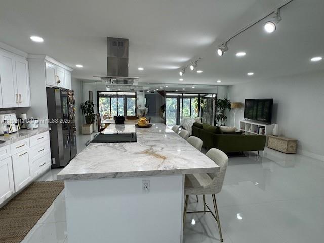 9709 North New River Canal Road, Unit 207 Plantation, FL 33324 - Photo 11 of 18 a large kitchen with a table and chairs