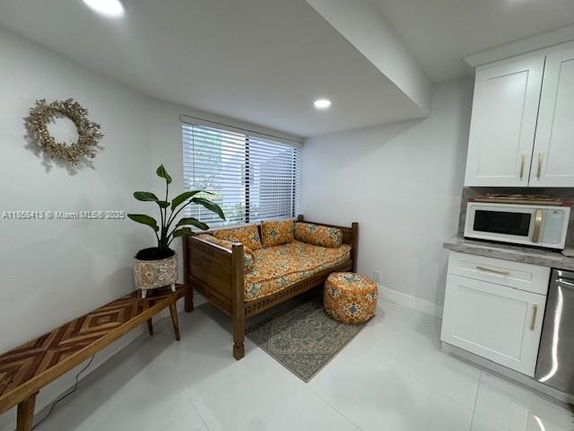 9709 North New River Canal Road, Unit 207 Plantation, FL 33324 - Photo 18 of 18 a bedroom with a bed and a couch