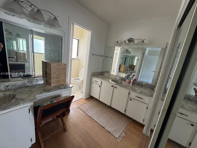 9709 North New River Canal Road, Unit 207 Plantation, FL 33324 - Photo 5 of 18 a bathroom with a sink a toilet and mirror