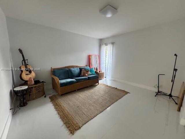 9709 North New River Canal Road, Unit 207 Plantation, FL 33324 - Photo 8 of 18 a living room with furniture and a rug