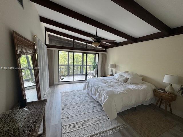 9709 North New River Canal Road, Unit 207 Plantation, FL 33324 - Photo 9 of 18 a bedroom with a large bed and a large window