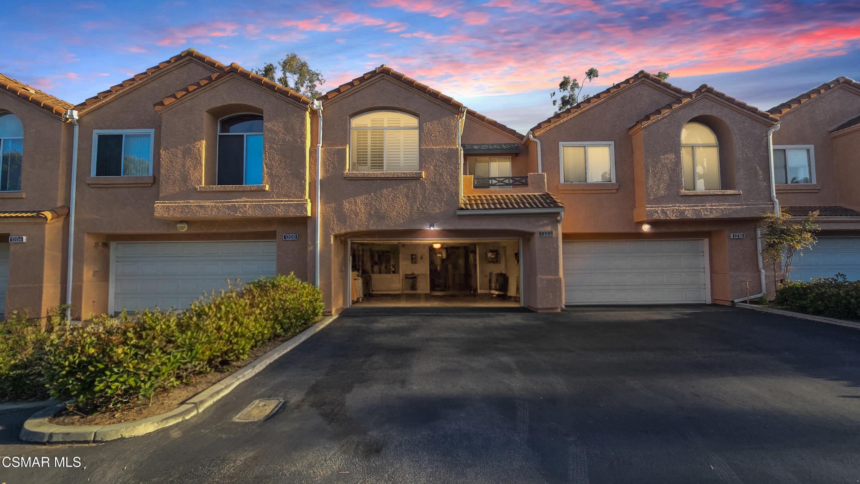 1212 Nautical Way Oxnard, CA 93030 - Photo 2 of 16 a front view of a house with a garden