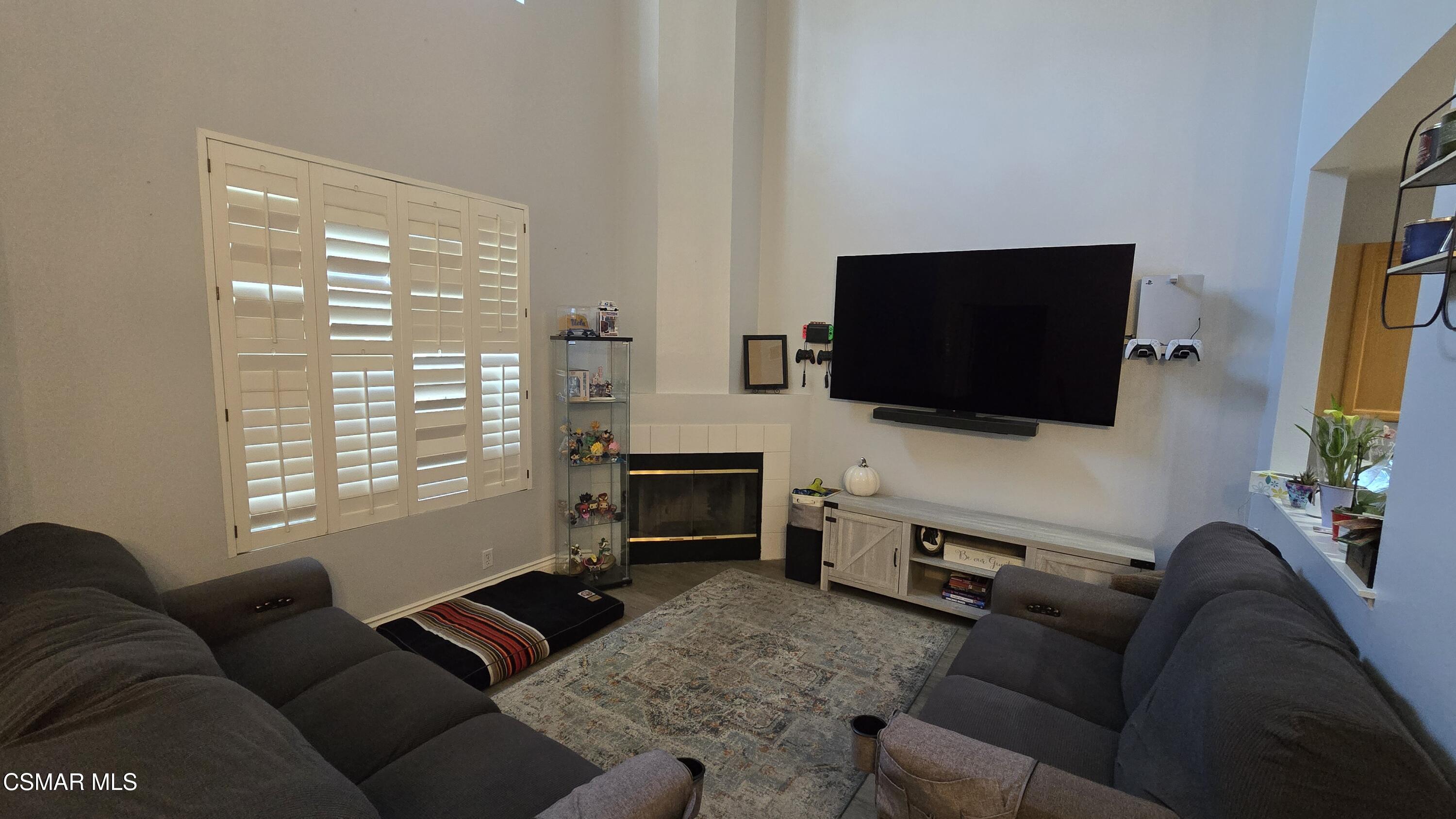 1212 Nautical Way Oxnard, CA 93030 - Photo 6 of 16 a living room with furniture and a flat screen tv