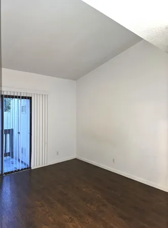 an empty room with wooden floor