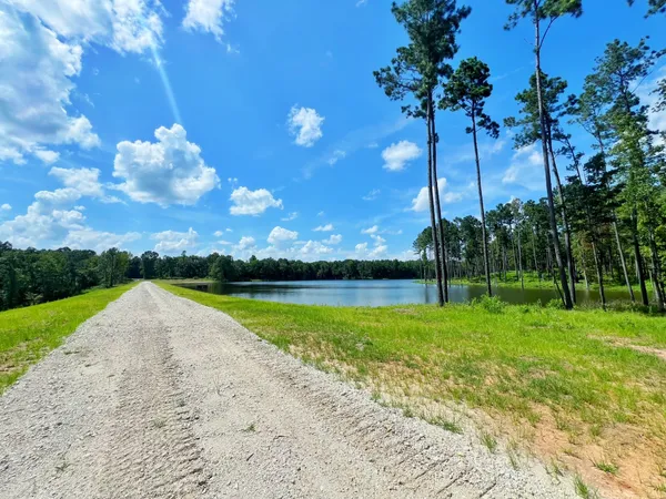 a view of a lake with a big yard