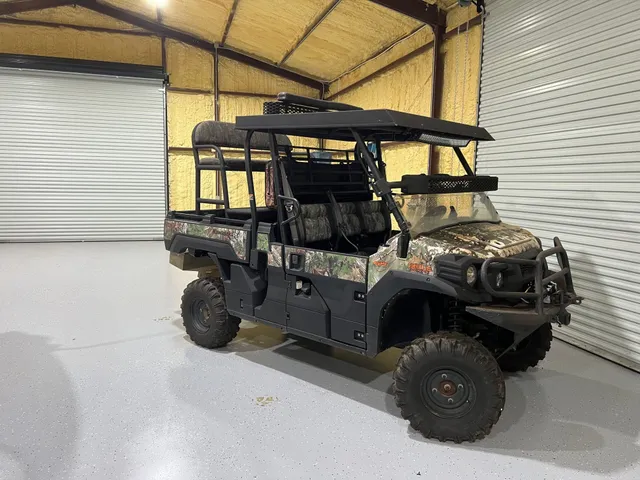 a view of a chairs and table in the backyard