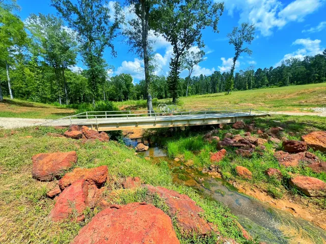 a view of a golf course with a lake view