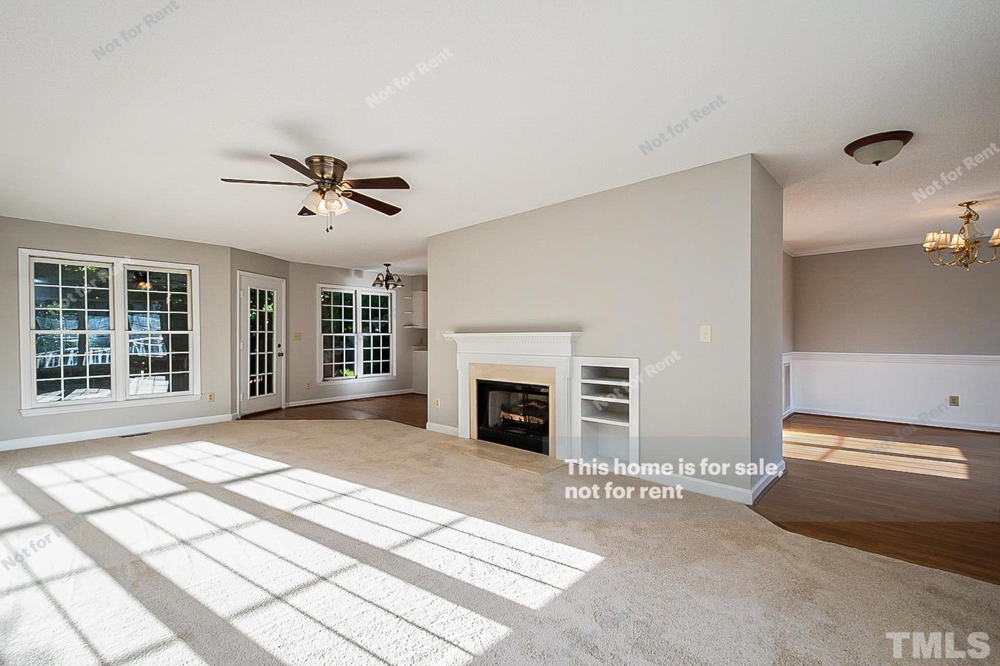 1945 Jupiter Hills Court Raleigh, NC 27604 - Photo 3 of 19 a view of a livingroom with a fireplace and window