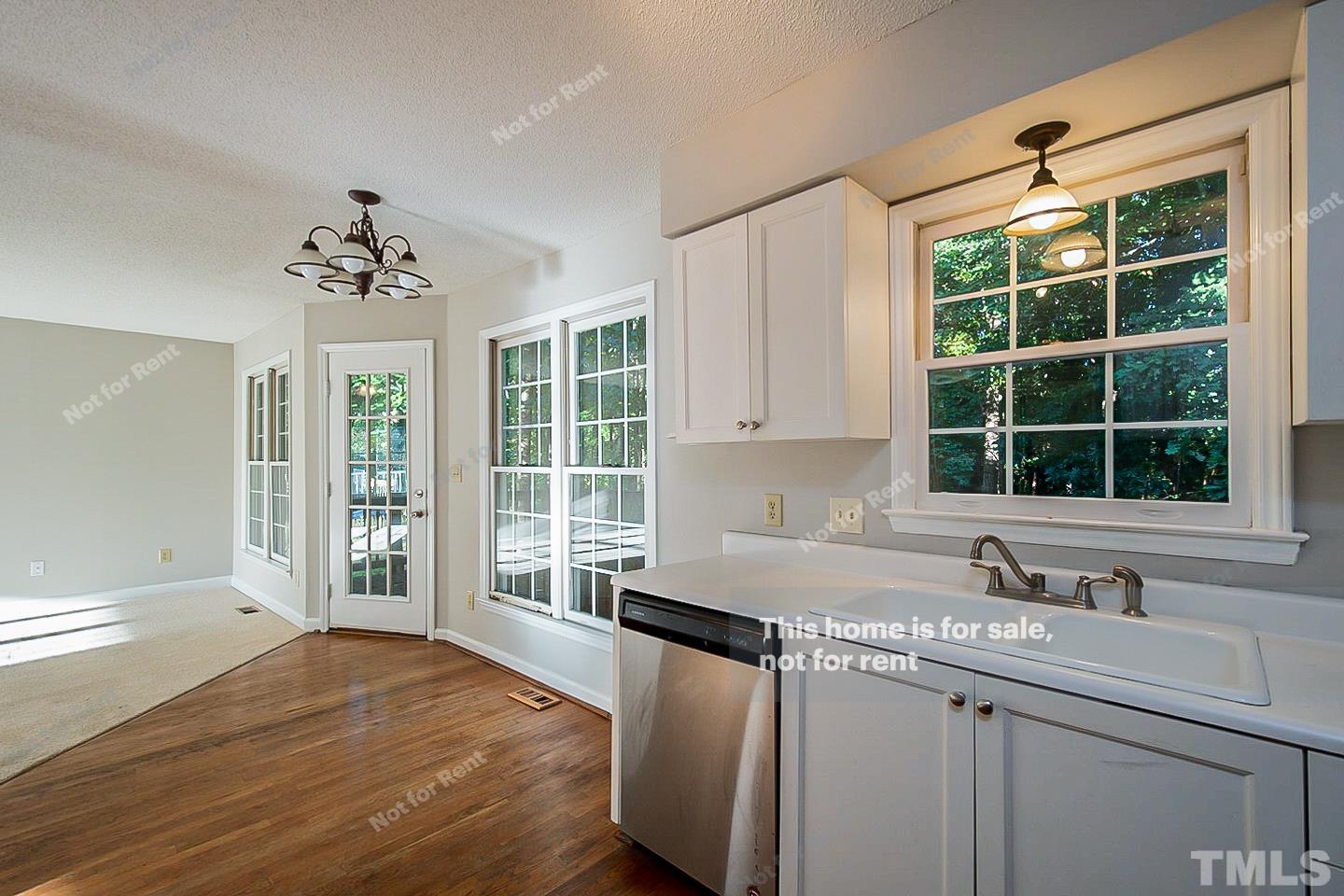 1945 Jupiter Hills Court Raleigh, NC 27604 - Photo 5 of 19 a kitchen with granite countertop a sink and a window