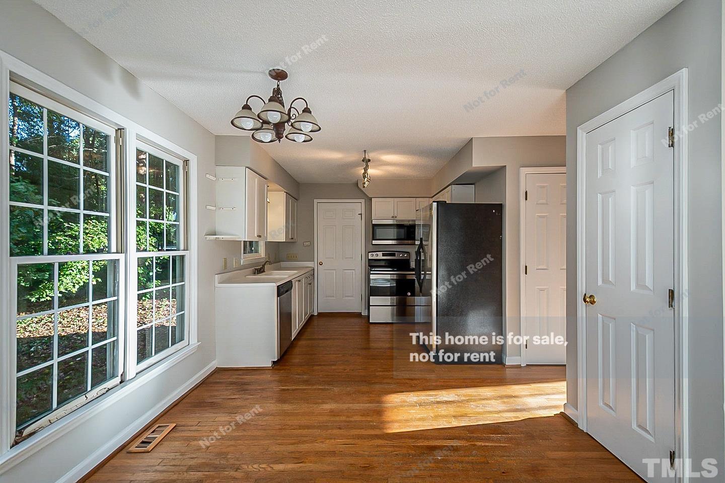 1945 Jupiter Hills Court Raleigh, NC 27604 - Photo 6 of 19 a view of a livingroom with a furniture wooden floor and window