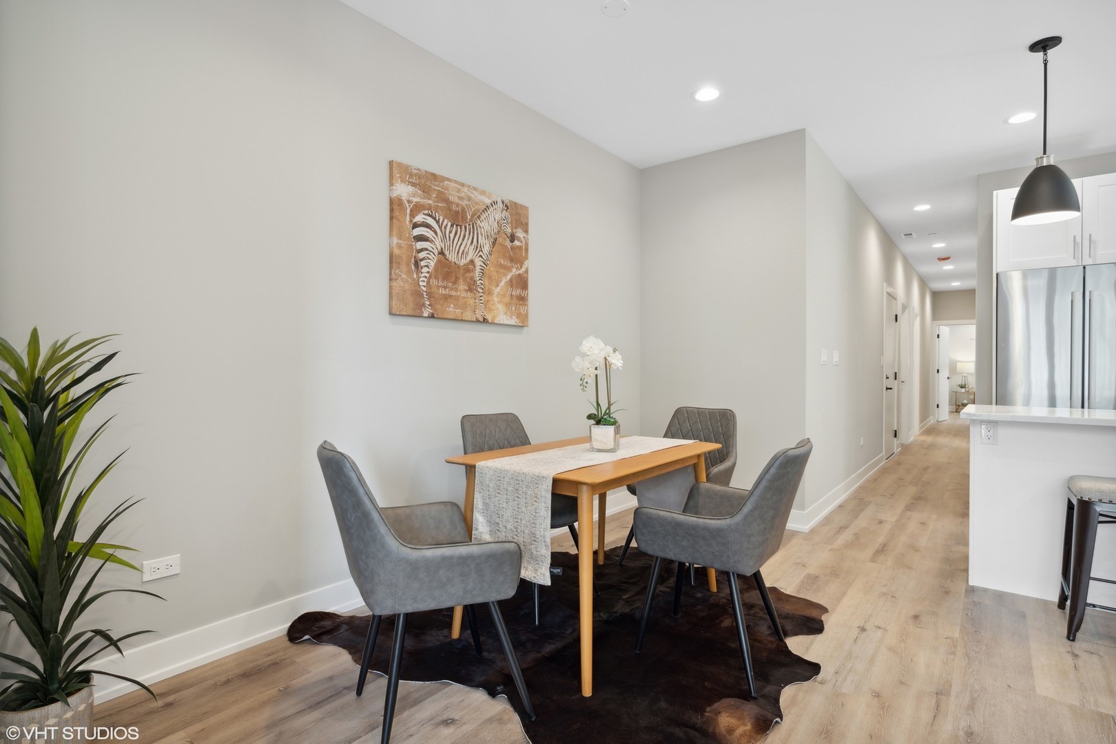 3335-3341 North Sheffield Avenue Chicago, IL 60657 - Photo 11 of 76 a view of a dining room with furniture and wooden floor