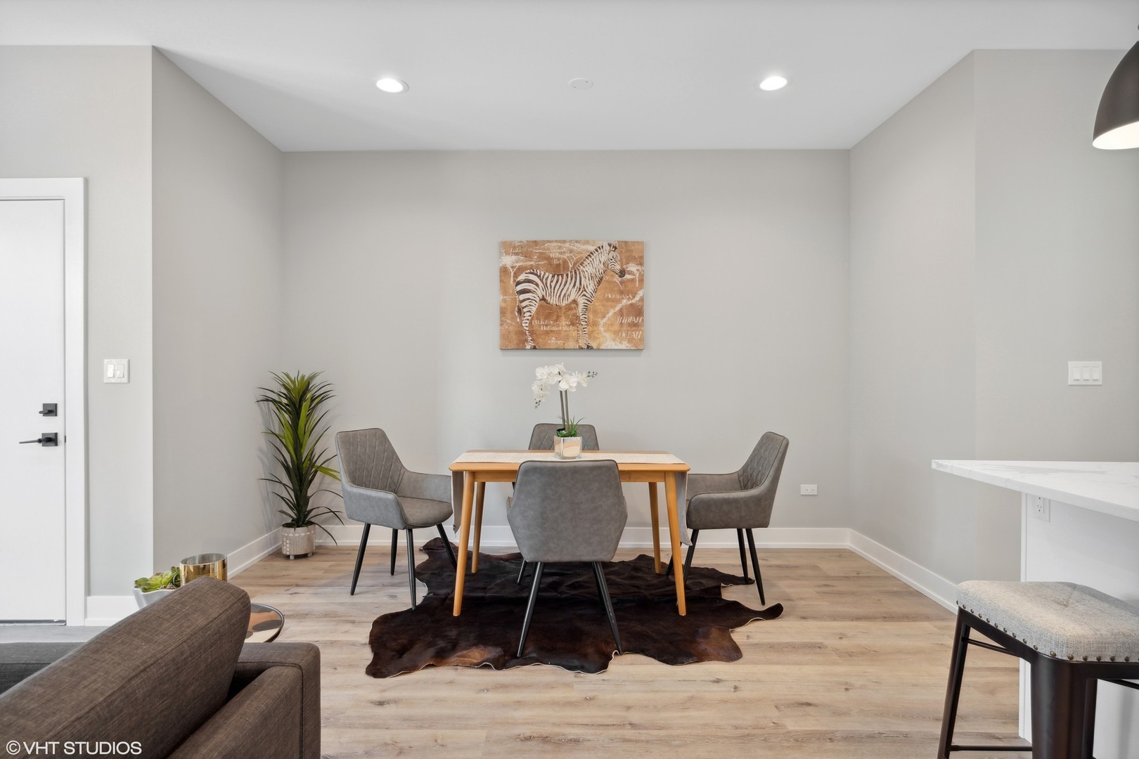 3335-3341 North Sheffield Avenue Chicago, IL 60657 - Photo 12 of 76 a view of a dining room with furniture and wooden floor