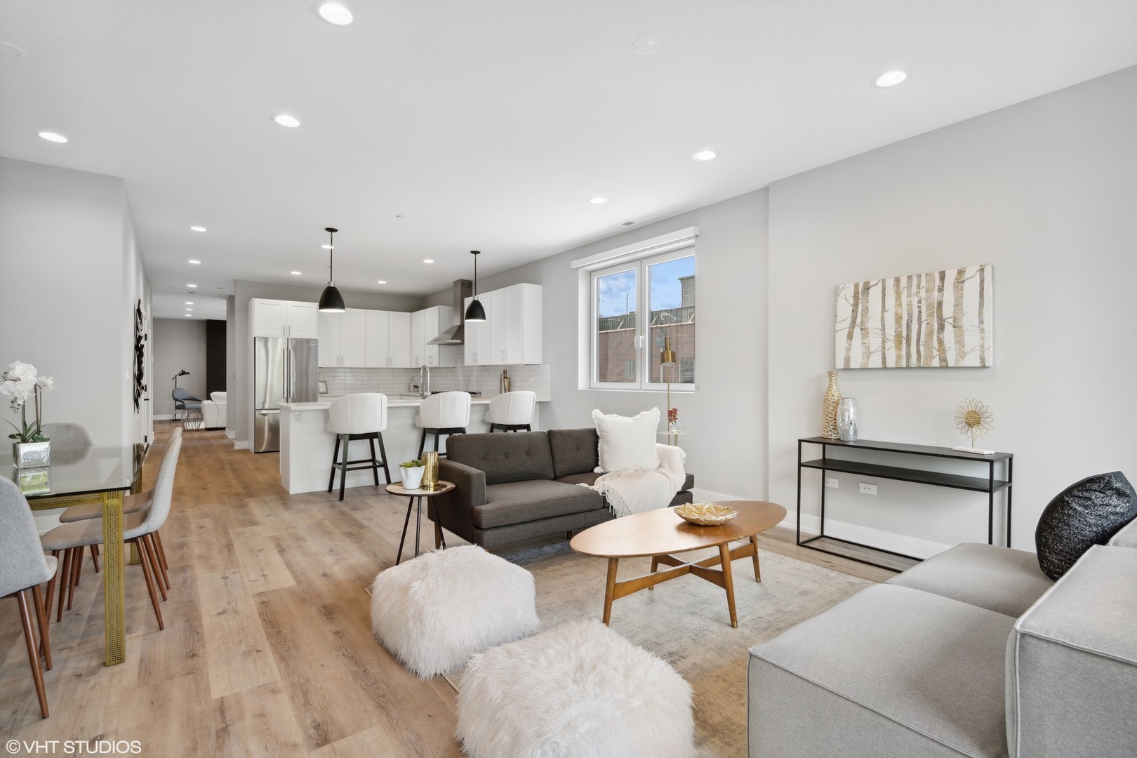 3335-3341 North Sheffield Avenue Chicago, IL 60657 - Photo 23 of 76 a living room with furniture and a dining table with kitchen view