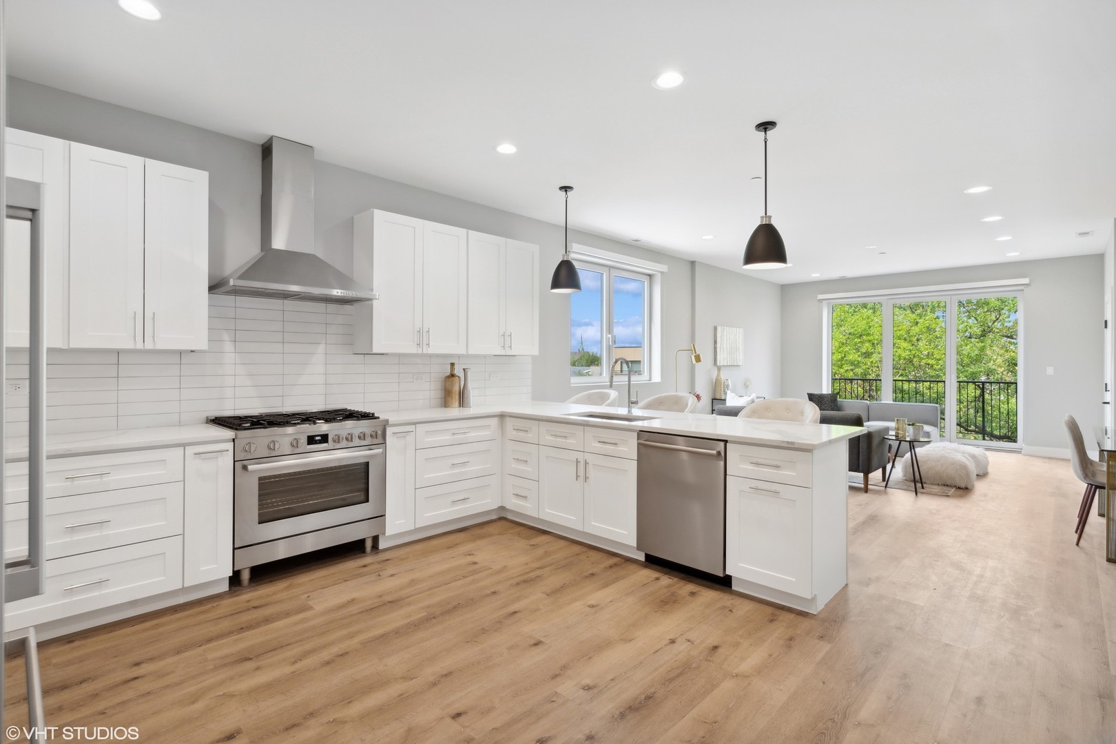 3335-3341 North Sheffield Avenue Chicago, IL 60657 - Photo 26 of 76 a kitchen with a stove a sink a window and wooden floor