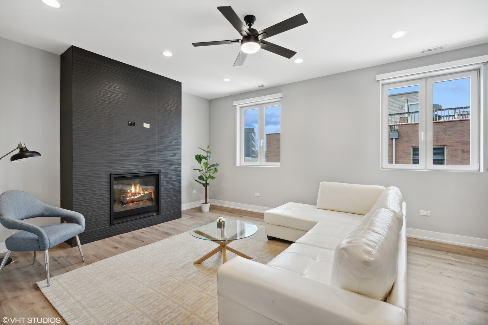 3335-3341 North Sheffield Avenue Chicago, IL 60657 - Photo 32 of 76 a living room with furniture and a fireplace