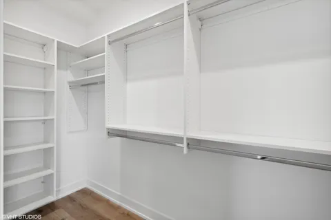 a view of a livingroom with furniture window and wooden floor