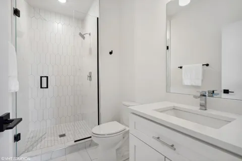 a bedroom with a bed and a desk