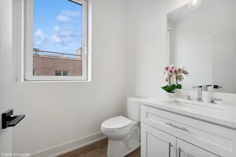a bathroom with a sink a toilet and bathtub