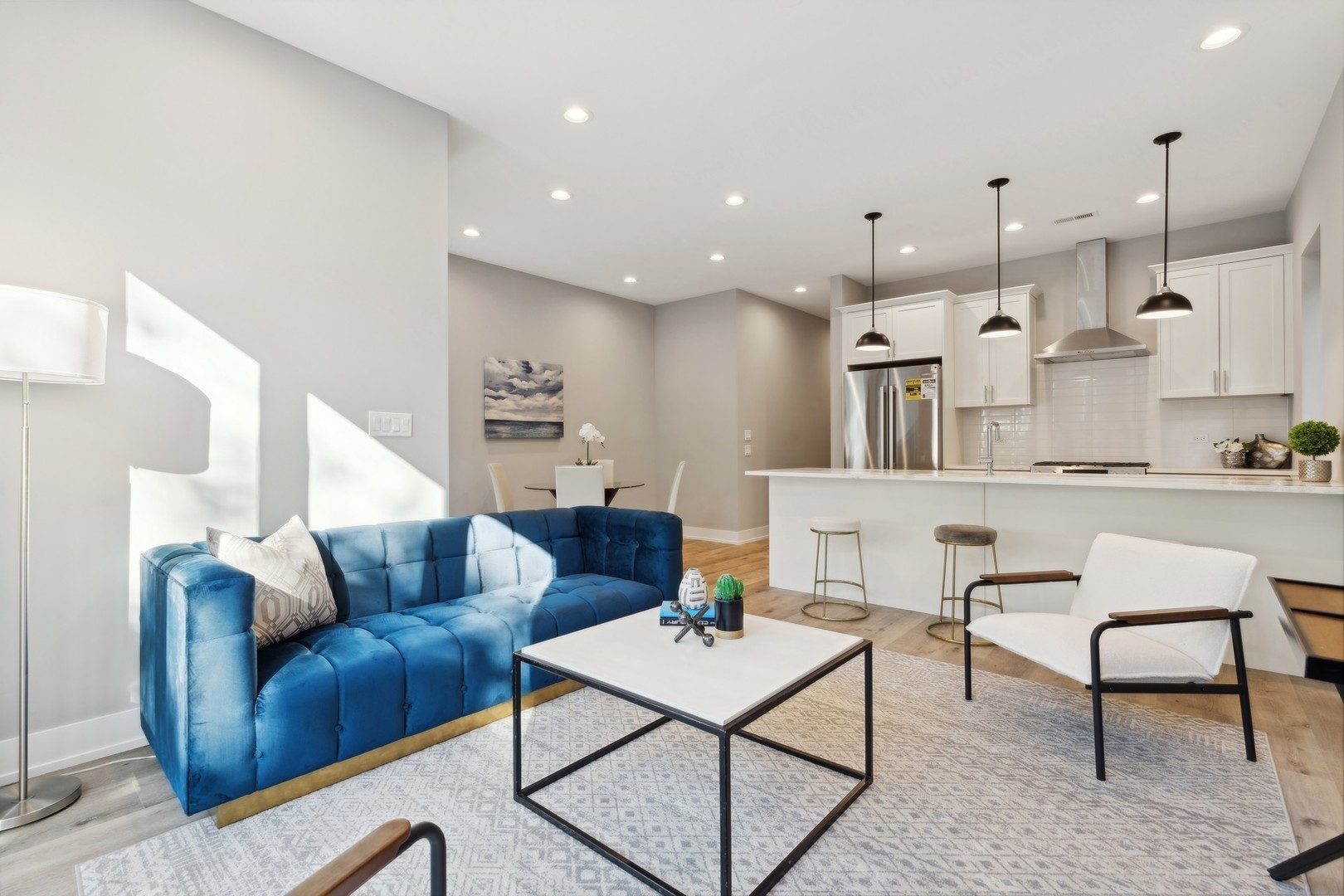 3335-3341 North Sheffield Avenue Chicago, IL 60657 - Photo 62 of 76 a living room with furniture kitchen view and a table