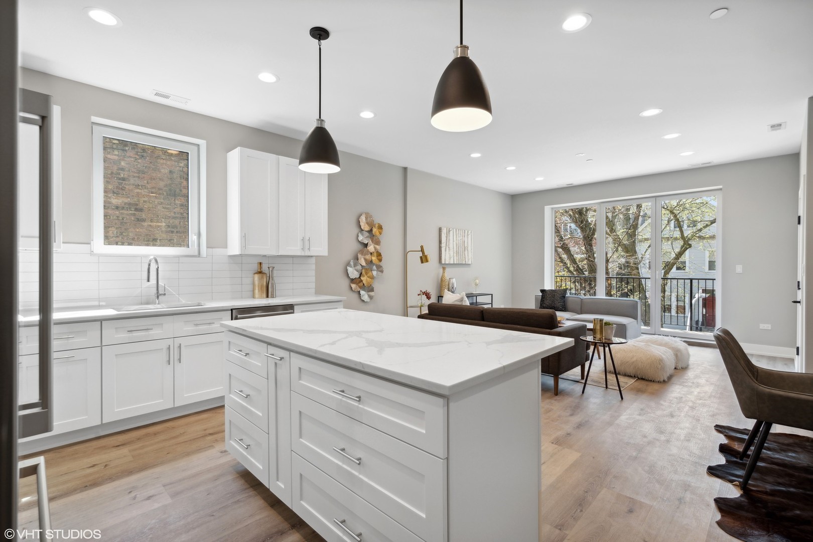 3335-3341 North Sheffield Avenue Chicago, IL 60657 - Photo 7 of 76 a kitchen that has a sink a stove and a table in it