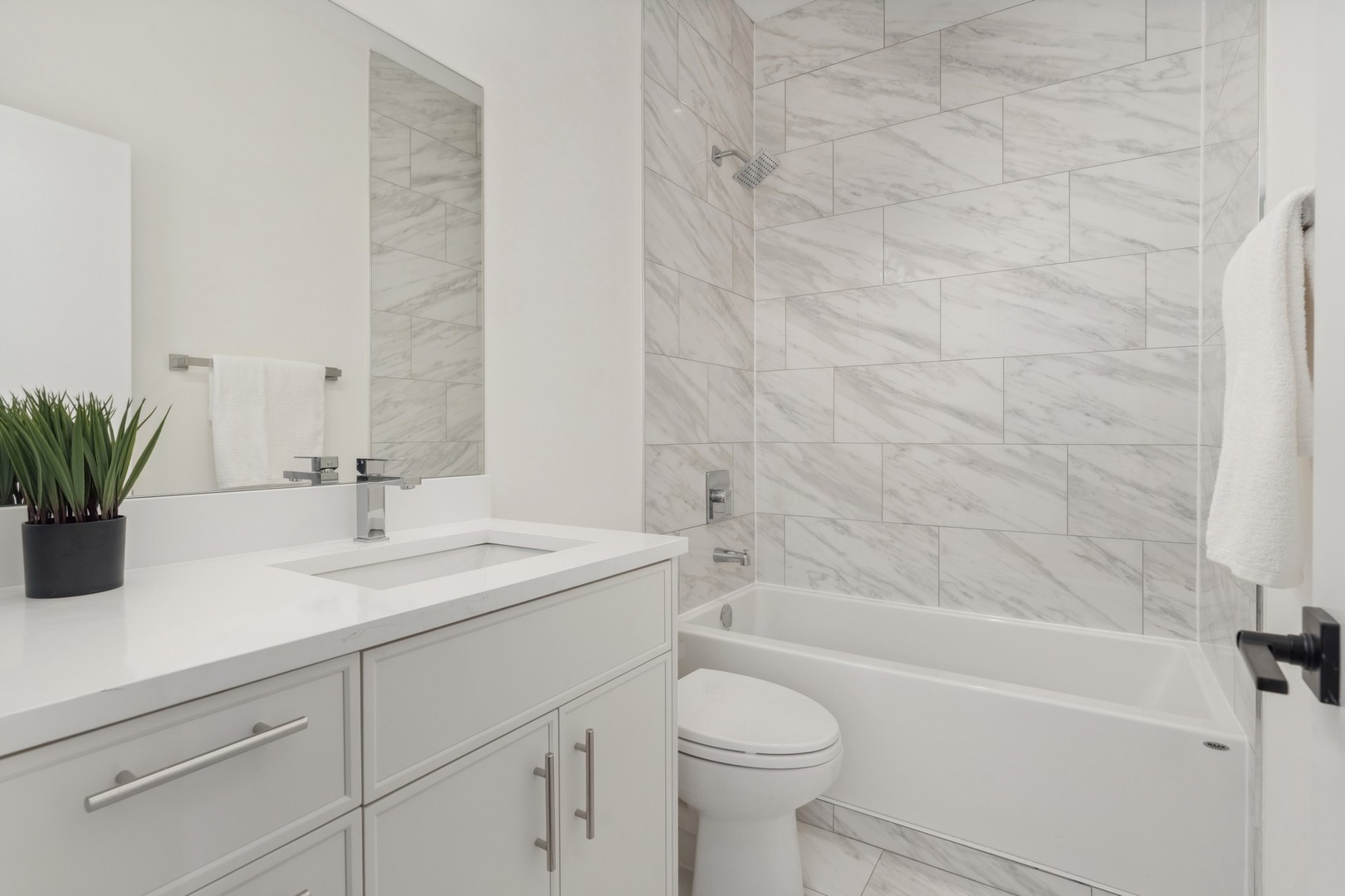 3335-3341 North Sheffield Avenue Chicago, IL 60657 - Photo 74 of 76 a bathroom with a sink a toilet and bathtub