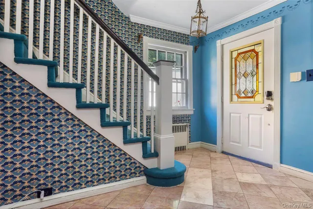 a view of entryway with wooden floor