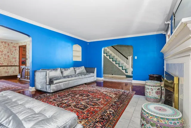 a living room with furniture and a rug