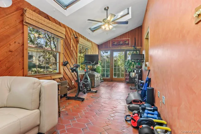 a view of a livingroom with furniture and a window