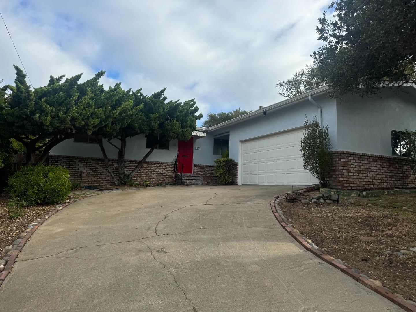 1373 Kimball Avenue Seaside, CA 93955 - Photo 2 of 13 a front view of a house with garden