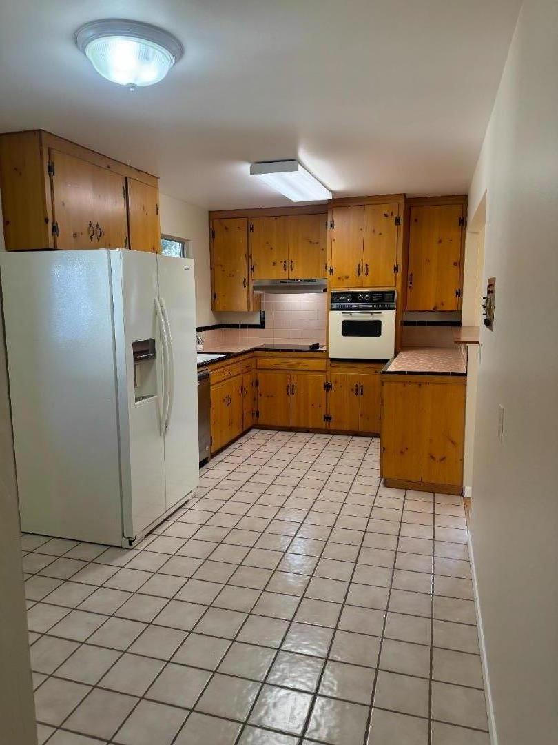 1373 Kimball Avenue Seaside, CA 93955 - Photo 5 of 13 a kitchen with stainless steel appliances a refrigerator sink and microwave