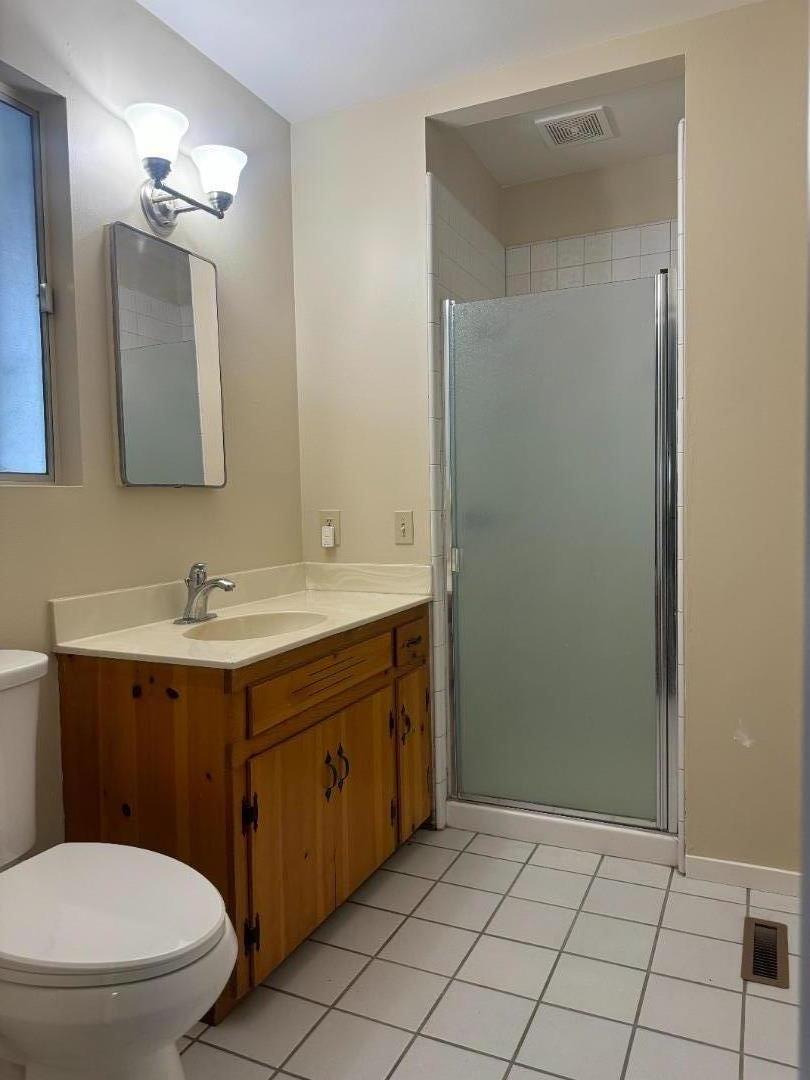 1373 Kimball Avenue Seaside, CA 93955 - Photo 10 of 13 a bathroom with a sink a toilet and mirror