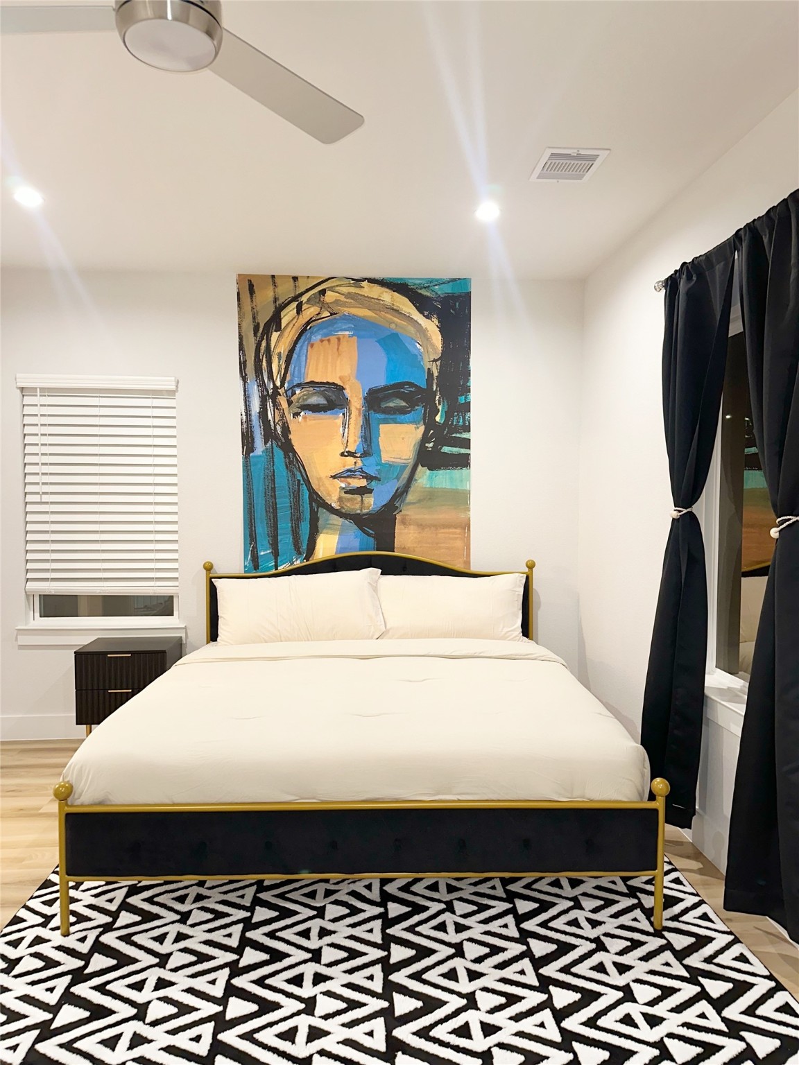 4513 Reed Road, Unit B Houston, TX 77051 - Photo 11 of 29 a bedroom with a bed and a painting on the wall