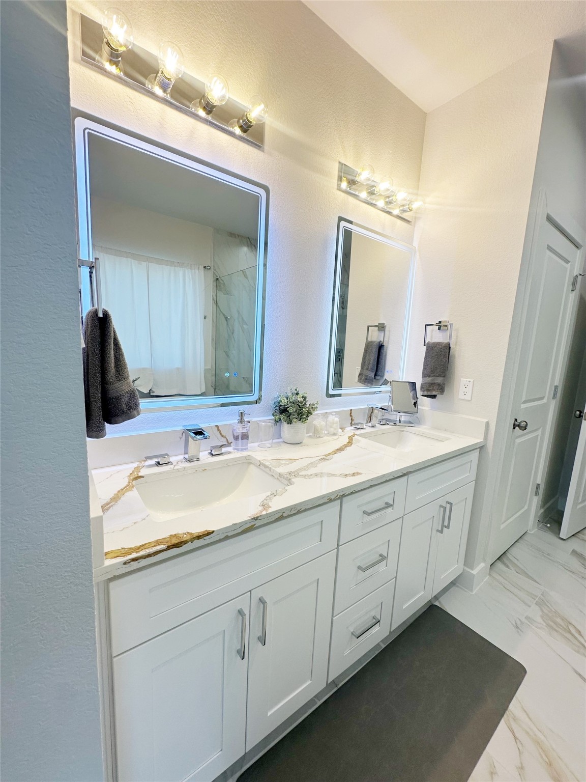 4513 Reed Road, Unit B Houston, TX 77051 - Photo 14 of 29 a bathroom with a double vanity sink and mirror