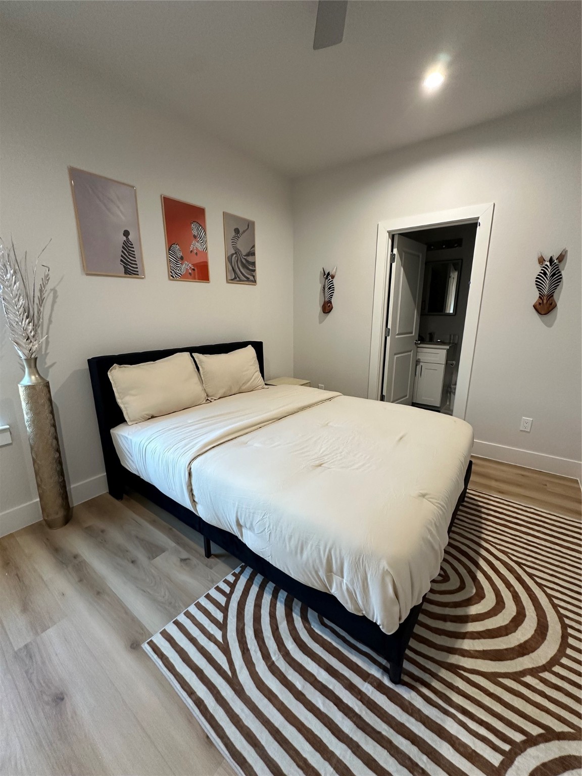 4513 Reed Road, Unit B Houston, TX 77051 - Photo 21 of 29 a bed sitting in a bedroom and night stand