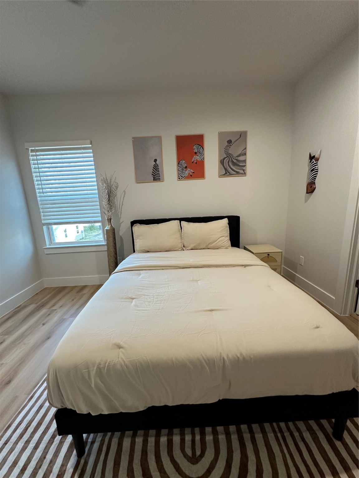 4513 Reed Road, Unit B Houston, TX 77051 - Photo 22 of 29 a bedroom with a bed and window