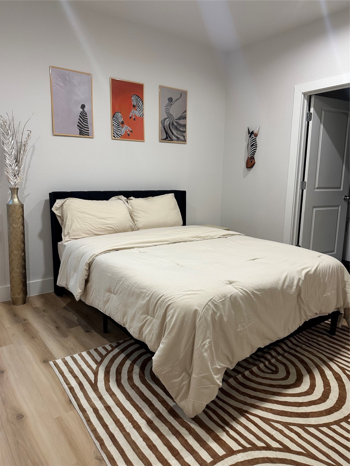 4513 Reed Road, Unit B Houston, TX 77051 - Photo 23 of 29 a bedroom with a bed and wooden floor