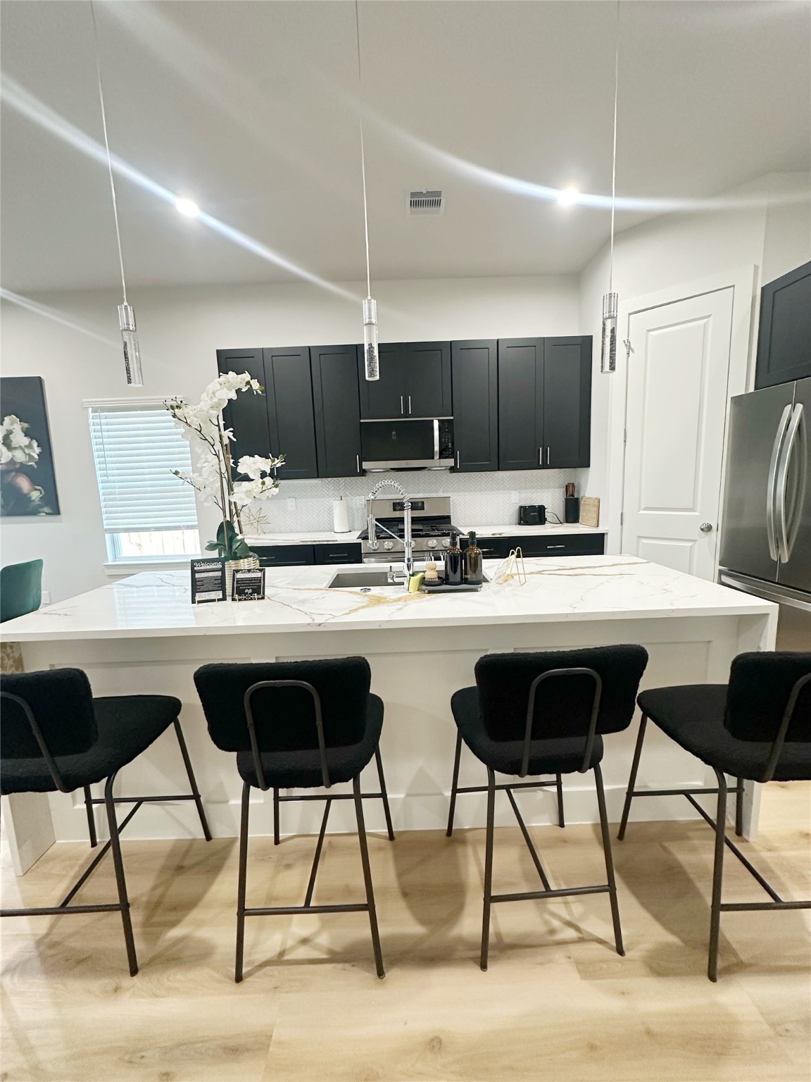 4513 Reed Road, Unit B Houston, TX 77051 - Photo 3 of 29 a kitchen with a dining table chairs and view kitchen