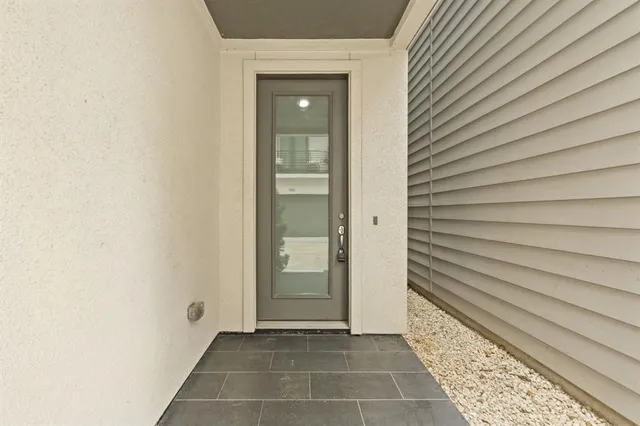 a view of a door and a window